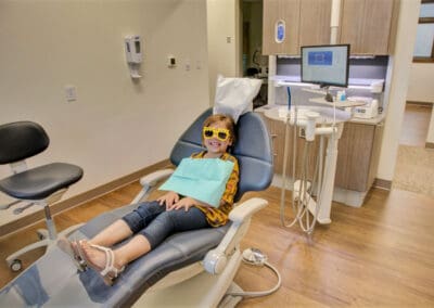 Child seated in dental chair