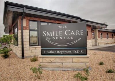 Smile Care Dental Center Front angle closeup of sign